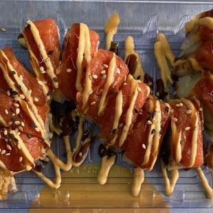 Red Dragon (tempura shrimp, avocado; topped with spicy tuna, spicy mayo and eel sauces)