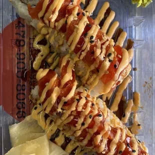 Double spicy tuna (spicy tuna, avocado, cream cheese; topped with spicy mayo and eel sauces)