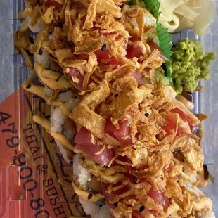 Zabb Roll (salmon, avocado; topped with spicy tuna, fried onions, spicy mayo and eel sauces)