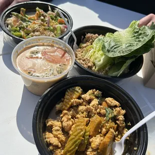 three bowls of food on a table