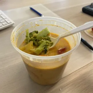 a bowl of soup with a spoon in it