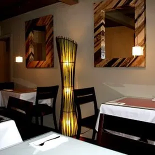 a dining room with tables and chairs