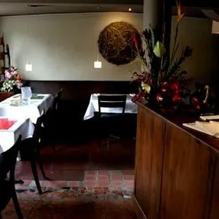 a dining room with tables and chairs