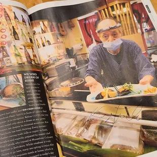 a man preparing food in a restaurant