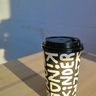 a coffee cup on a table