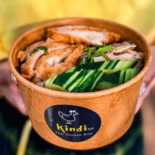 a person holding a bowl of food