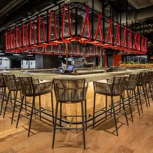 a bar with a large chandelier