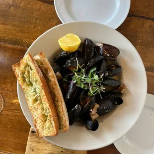 Mussels and sausage in white wine and garlic sauce