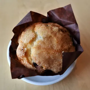 a muffin in a paper wrapper