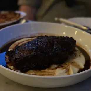 16 oz Prime Ribeye served medium-rare: as all steak should be. Comes w. pommes puree &amp; a fresh take on creamed spinach.