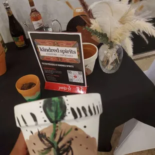 a person holding a plant in their hand