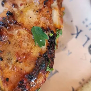 Tandoori chicken close up... not "tandoori" but definitely well-seasoned.