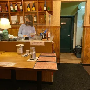 a woman behind a counter