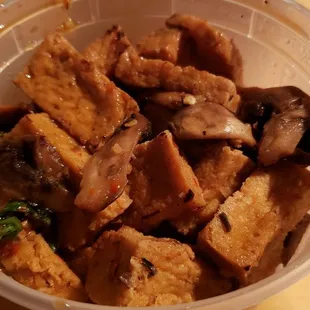 Holy basil stir fry made vegan ($16). Really tasty &amp; spicy. Love the chewy/meaty tofu.