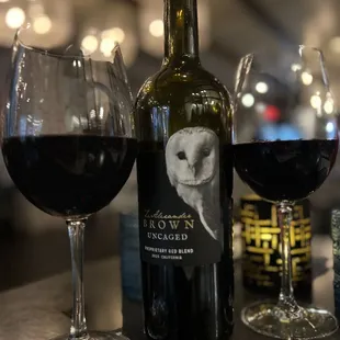 a glass of wine and a bottle of wine