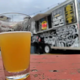 a glass of beer on a table