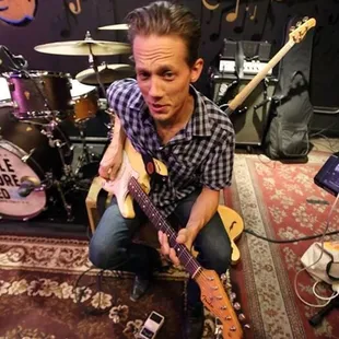 a man playing a guitar