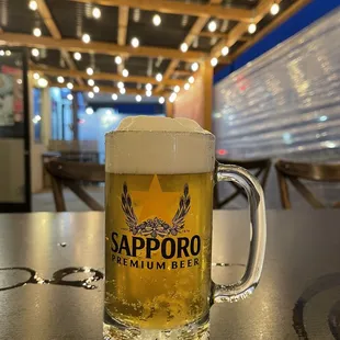 a glass of beer on a table