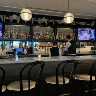 a bar with a large screen tv