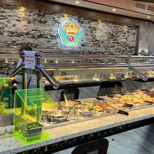 a man standing in front of a buffet