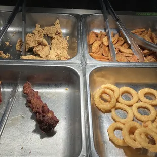 a variety of food items in trays