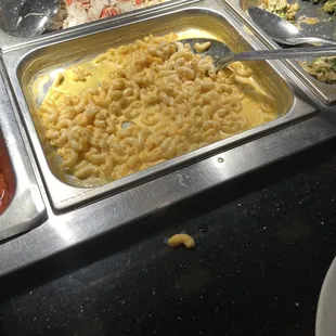 a variety of food items in a buffet