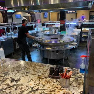 a chef preparing food in a kitchen