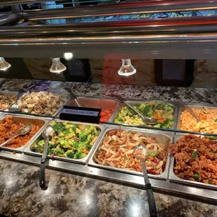 a variety of food in a buffet