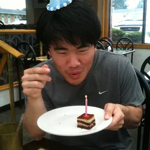 a man eating a piece of cake