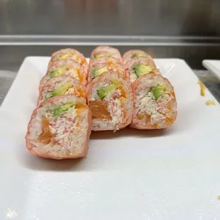 sushi rolls on a white plate