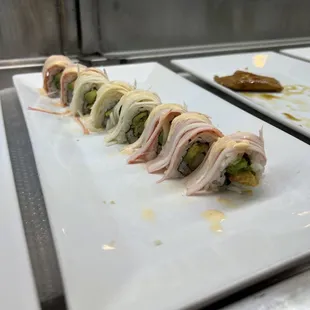 a long row of sushi rolls