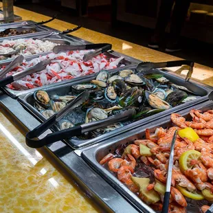 a variety of seafoods in a buffet