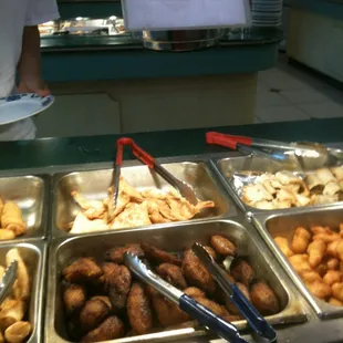 a variety of trays of food