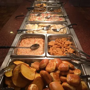 a variety of food items on a buffet table