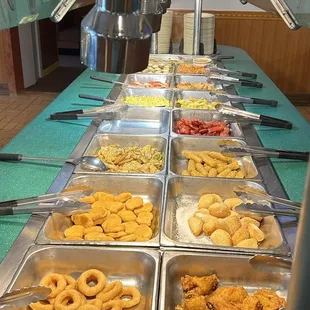 a variety of food items in trays