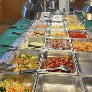 a variety of food items in a buffet