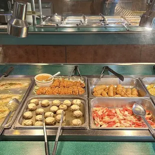 a variety of food items in a buffet