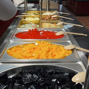 a variety of food in a buffet