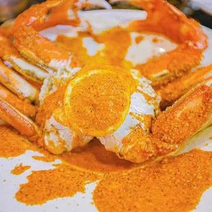 a plate of king crab with a fried egg on top