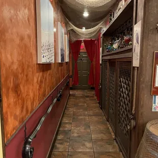 a hallway leading to a bed