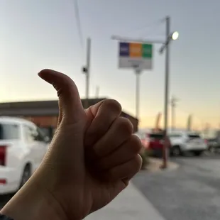 a hand giving the thumbs up
