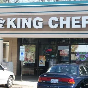 a car parked in front of a restaurant