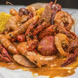 a plate of shrimp and corn