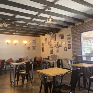 Indoor seating for 2, bigger tables on other side.