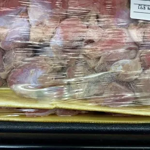 a close up of meat wrapped in plastic