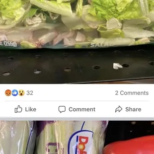 a bag of lettuce and a red pepper