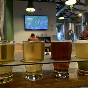 1 of 3 TV's in this room, so you can sit anywhere in here and watch a game. And of course here pictured is my flight of 4 yummy beers!