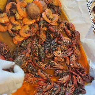 Crawfish (mysterious black stuff on the crawfish), shrimp headless, potatoes, corn
