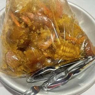 1. One lb. Snow Crab Legs, 1/2 lb. Shrimp add sausages