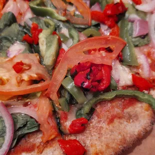 Pizza with veggies and whole grain, thin crust.